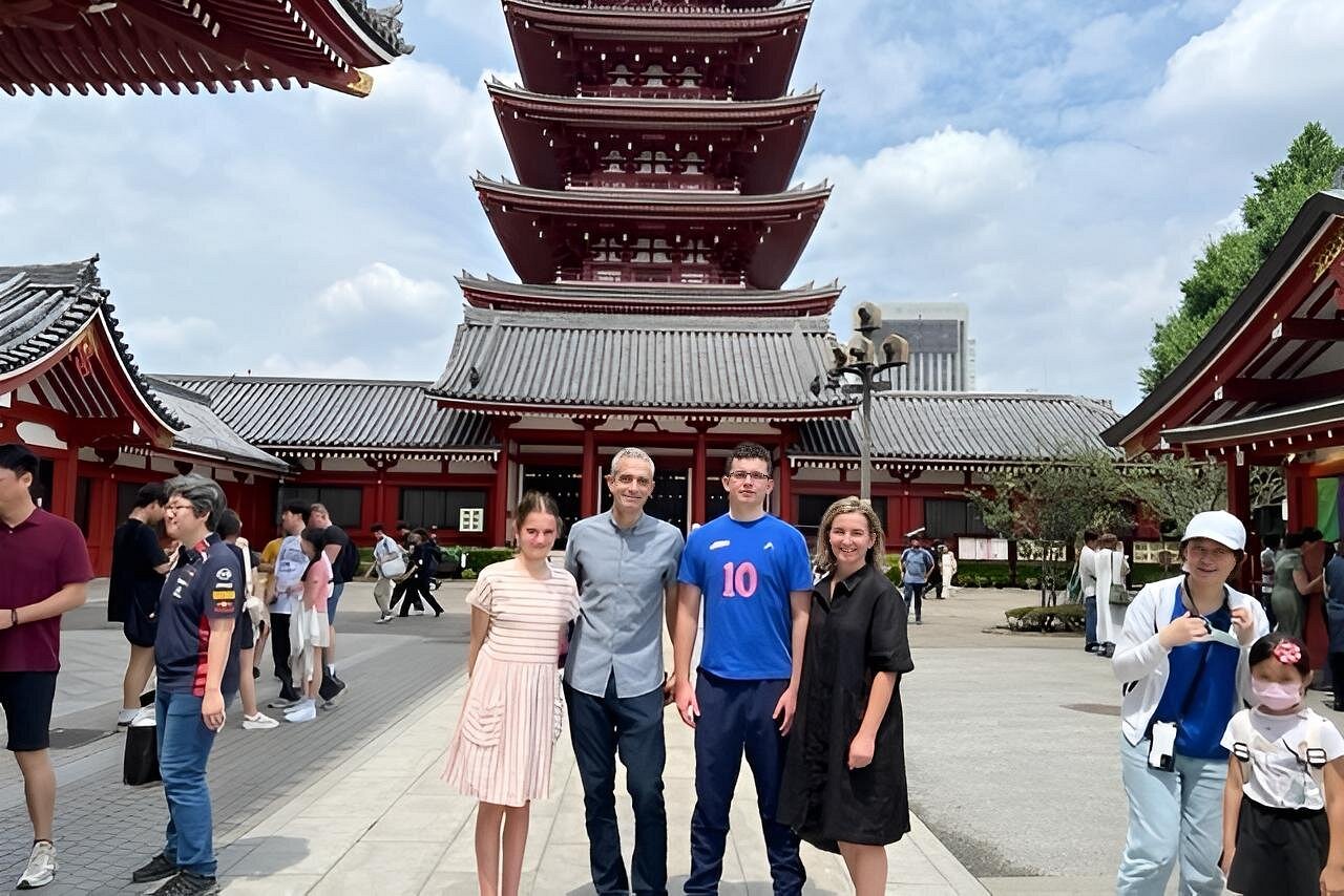 Travelers in front of the five-story pagoda at Senso-ji in Asakusa